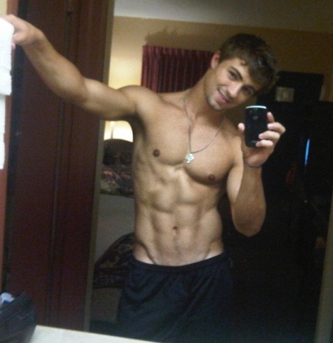 Good Looking Muscled Guy Show His Abs
