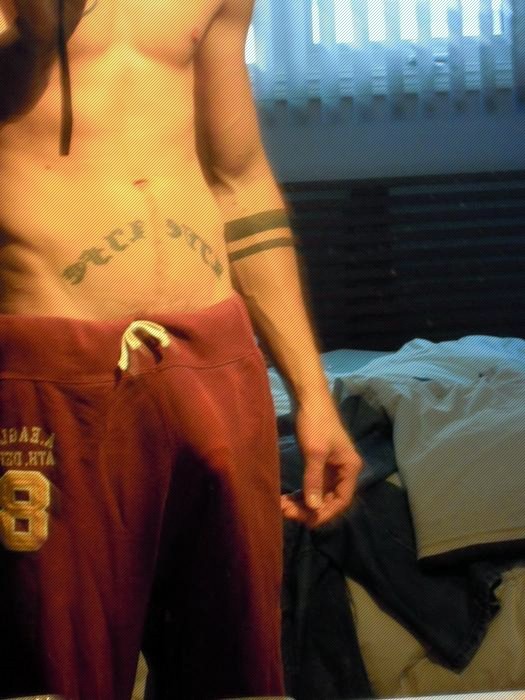 Tattooed Boy With Hard Dick Pushing His Shorts